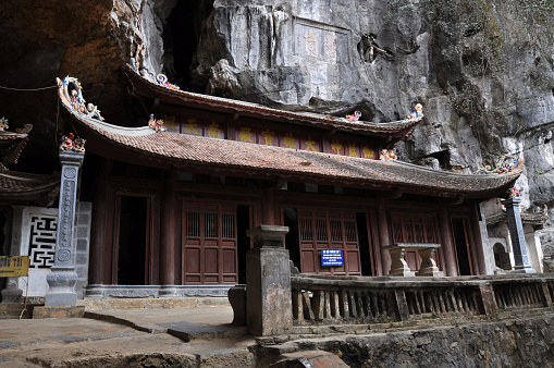 BICH DONG, NINH BINH, VIETNAM - FEBRUARY 21, 2013: The Bich Dong pagoda was built in the Middle Age, and includes three buildings. One of them was built in a cave