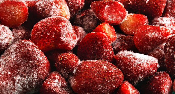 istock Panorama of frozen fresh strawberries 890671894