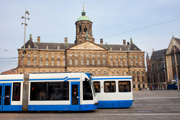 istock Royal Palace and Trams in Amsterdam 890681916
