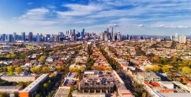 D Melbourne CBD From port Aerial view of Melbourne city CBD high-rise towers from Port Melbourne and Southbank above residential suburb house roofs and local streets, roads, cars and parks. melbourne australia stock pictures, royalty-free photos & images