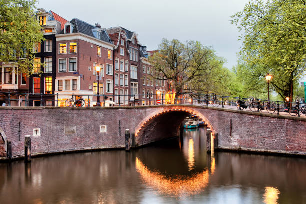 istock Canal Bridge in Amsterdam at Evening 890686924