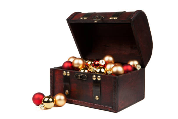 istock Christmas decorations in an old vintage suitcase isolated on white 890687172