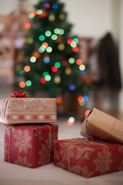 istock Christmas Gift on floor and defocused lights 890692784