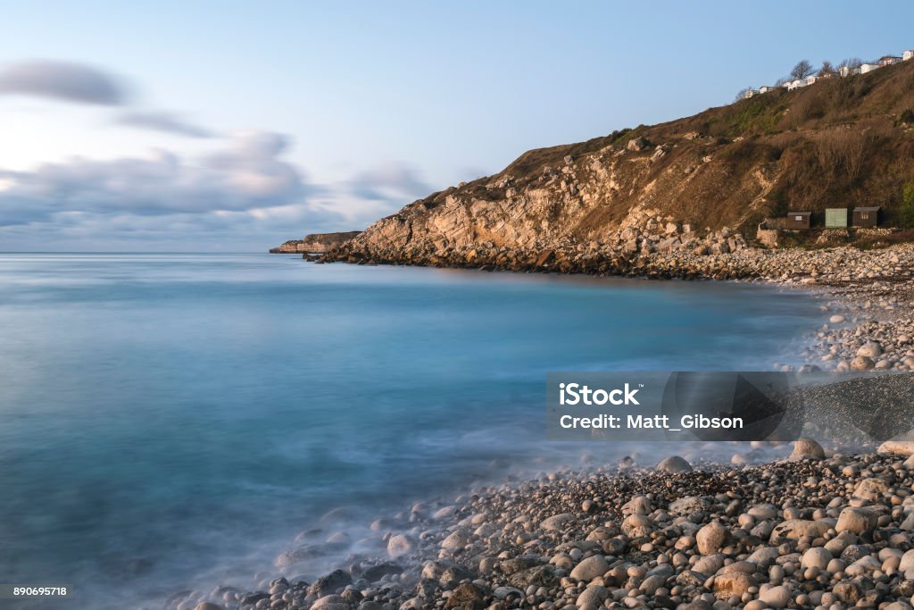 Beautiful sunrise landscape image of Church Ope Cove in Portland Dorest England Beautiful sunrise landscape image of Church Ope Cove in Dorest England Beach Stock Photo