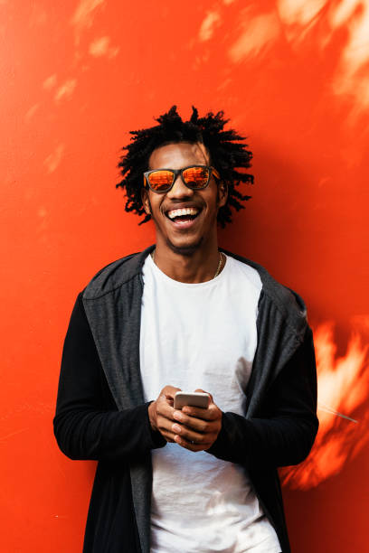 istock Portrait of handsome afro man using his mobile. 890698792