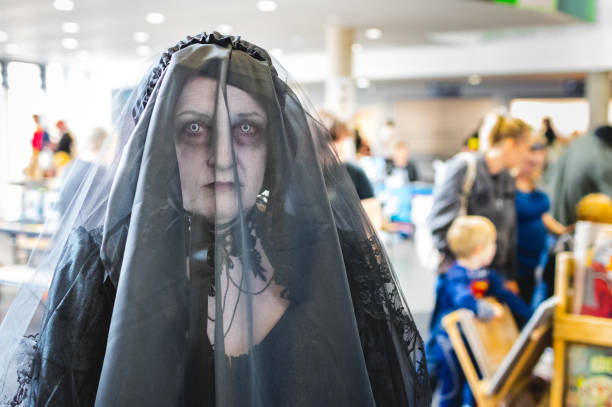 Cosplayer dressed as the Woman in Black from the movie Woman in Black at Megacon convention in Carlisle.