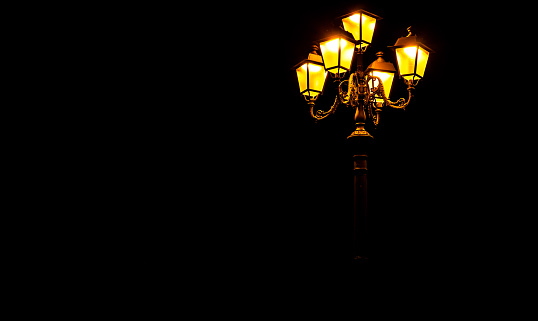 Street lamp on black background with copy space