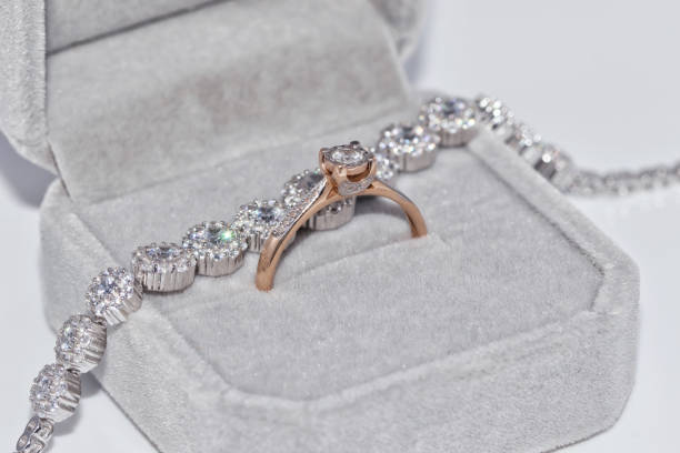 istock Fine elegant gold ring with a diamond and silver bracelet with precious stones 890716976