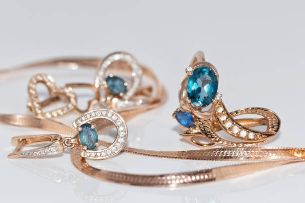 istock Gold earrings and ring with blue Topaz 890717048