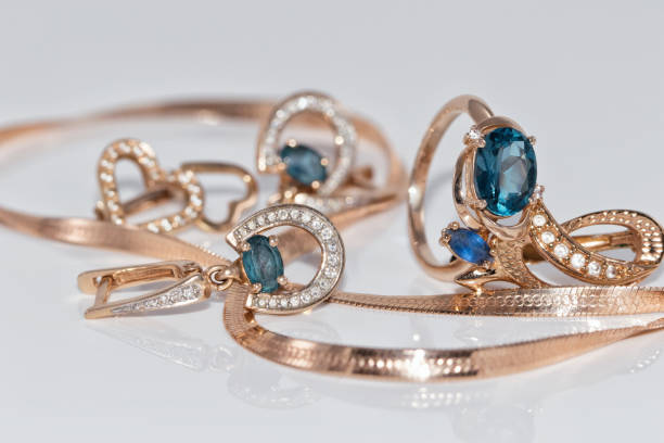 istock Gold earrings and ring with blue Topaz 890719314