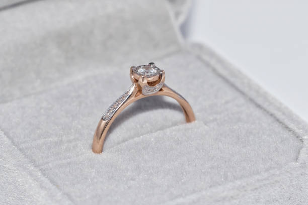 istock Fine elegant Golden ring with a diamond 890719566