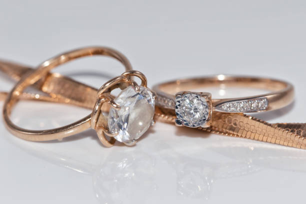 istock Fine elegant Golden ring with diamond and gold chain 890719632