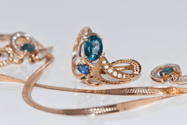 istock Gold earrings and ring with blue Topaz 890720128