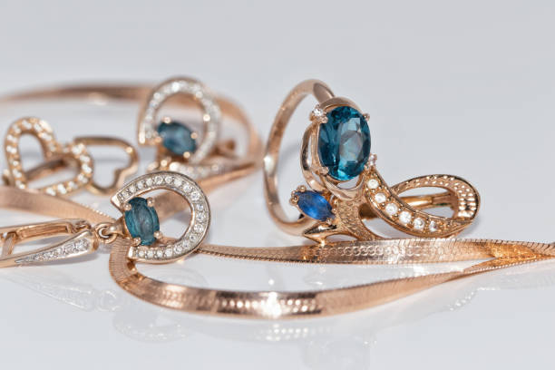 istock Gold earrings and ring with blue Topaz 890720554