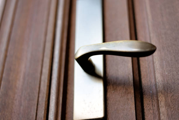 Knob Knob of a wooden door. door lever stock pictures, royalty-free photos & images