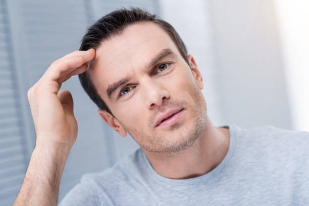 istock Disappointed frustrated man startling  with new 890723808