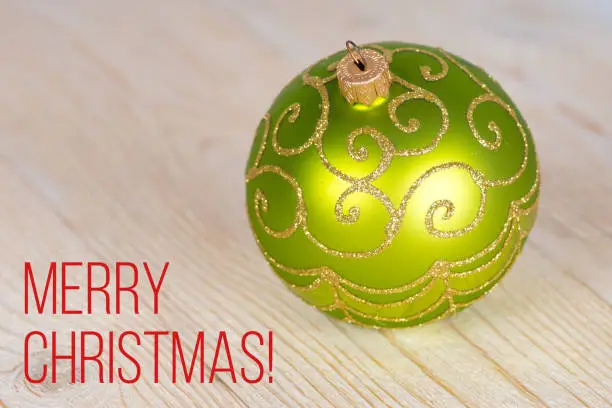 Merry Christmas, greetings green xmas tree ball
