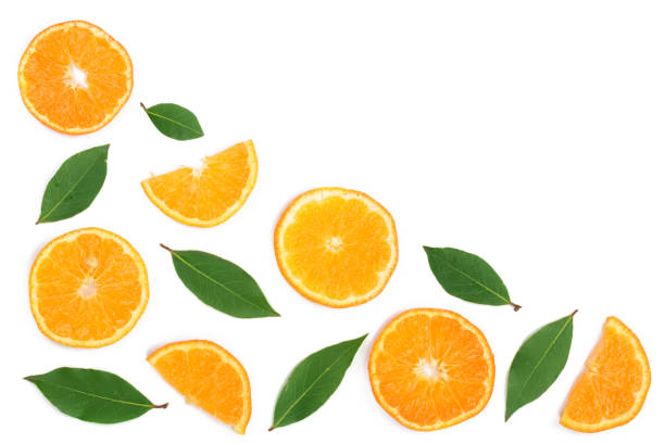 istock slices of tangerine with leaves isolated on white background with copy space for your text. Flat lay, top view. 890728708