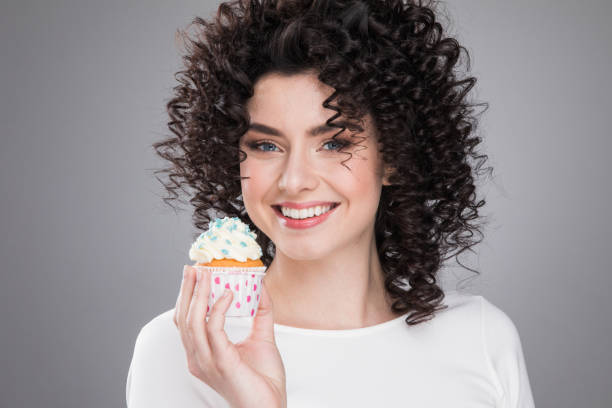 istock Happy woman with cake 890733080