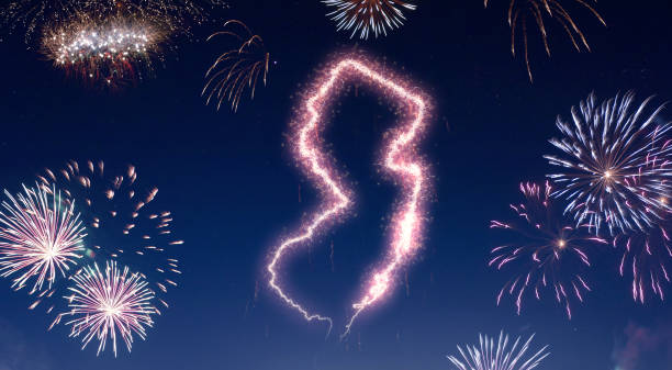 istock Night sky with fireworks shaped as New Jersey.(series) 890733188