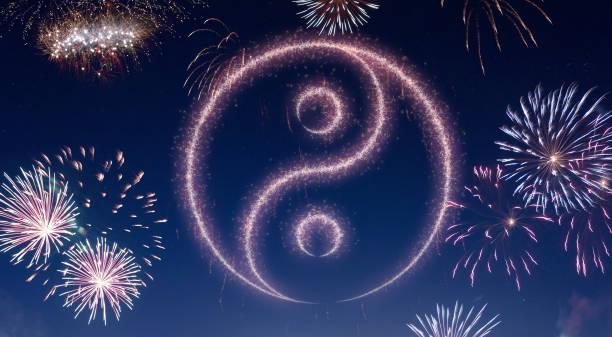 istock Night sky with fireworks shaped as a Ying Yang symbol.(series) 890733398