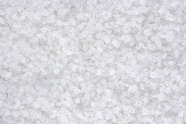 istock Sea salt background closeup top view texture 890736364