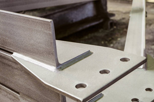 istock Jointing shaped element of galvanized metal construction close-up. Limited depth of field. 890736656