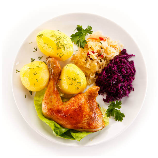 istock Roast chicken leg with boiled potatoes and vegetable salad 890737210