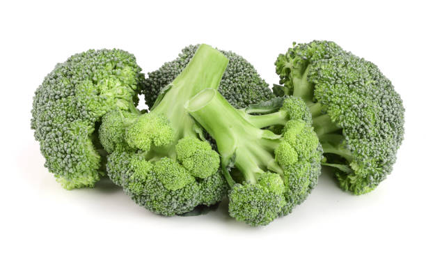 istock fresh broccoli isolated on white background close-up. Top view 890748440