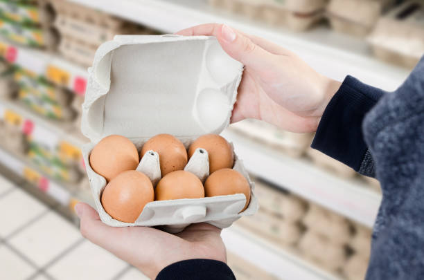 istock Man buys eggs in the supermarket 890754558