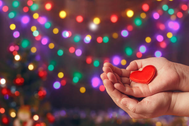 Do good things. Create well deeds. Charity and miracle. Christmas and New year mood. Festive background. To make people happy. Xmas miracle. Charitable foundation. Helping hand. Give love. Holiday. Do good. Thanksgiving day. Friendship. Welfare. Bokeh. donors choose stock pictures, royalty-free photos & images