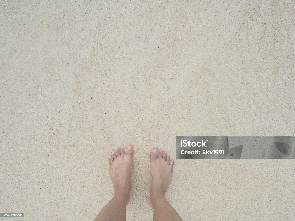 top feet on beach. relax summer in sea. mood of relaxing emotional. Above Stock Photo