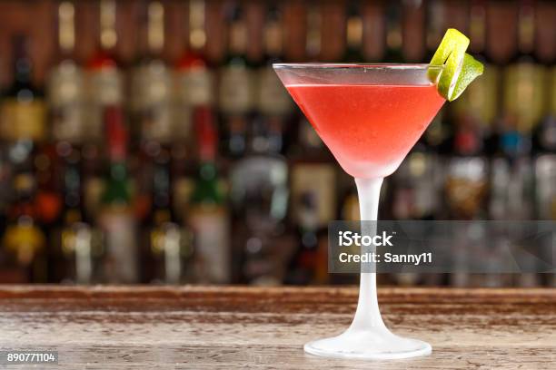 An Alcoholic Cosmopolitan Cocktail Is On The Bar Space For Text Stock Photo - Download Image Now