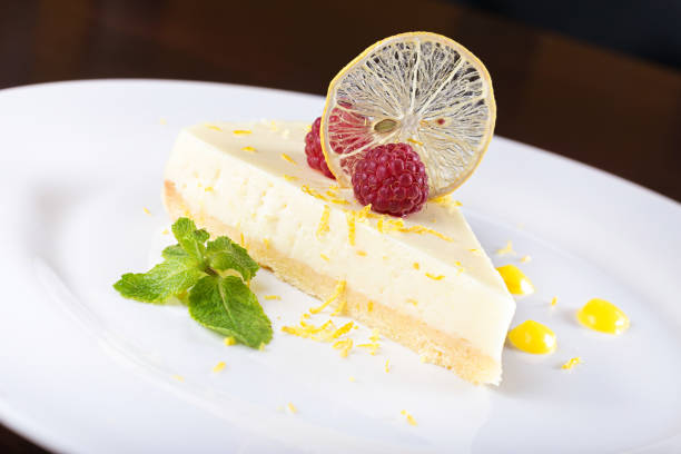 istock piece French lemon tart, garnished with fresh raspberries 890771584