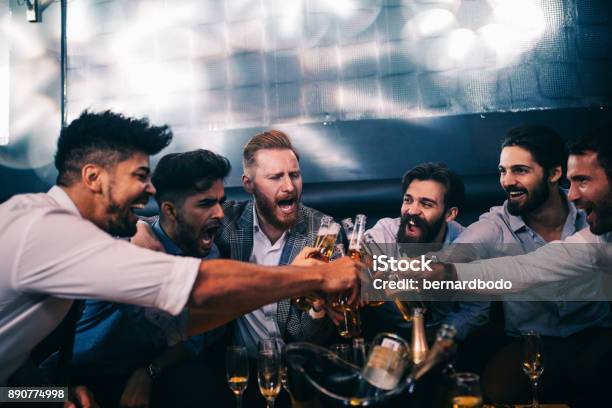 Enjoying Their Night Out Stock Photo - Download Image Now - Men, Stag Night, Only Men