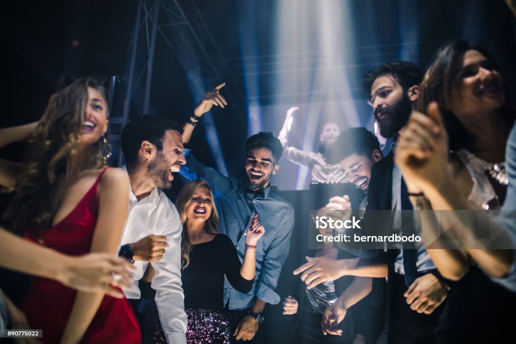 Party people Group of friends dancing in the nightclub Party - Social Event Stock Photo