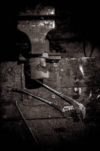 Black and White Photo of Vice and Locking Pliers on Workbench