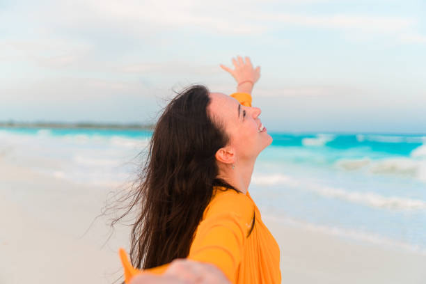 istock Young beautiful woman relax on white tropical beach 890775296