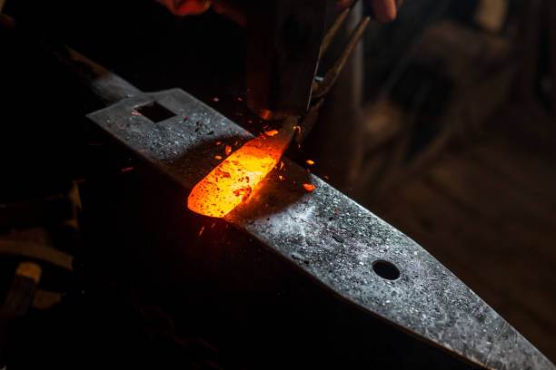 istock Molten Knife Blade Iron on Anvil 890775330