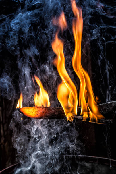 istock Handmade Knife Blade Burning, Surrounded by Smoke 890775354