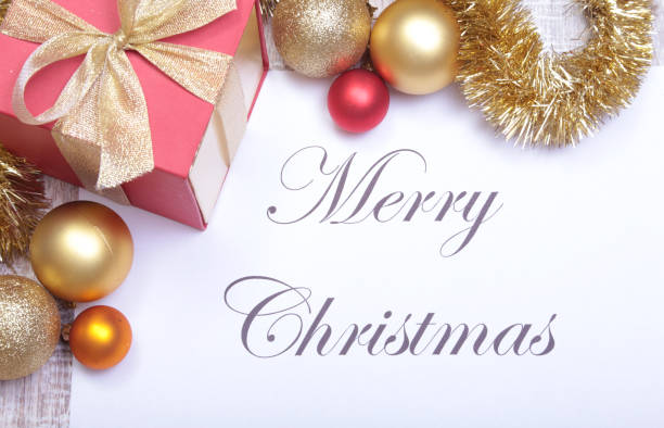 istock Text Merry Christmas on paper with many balls 890779064