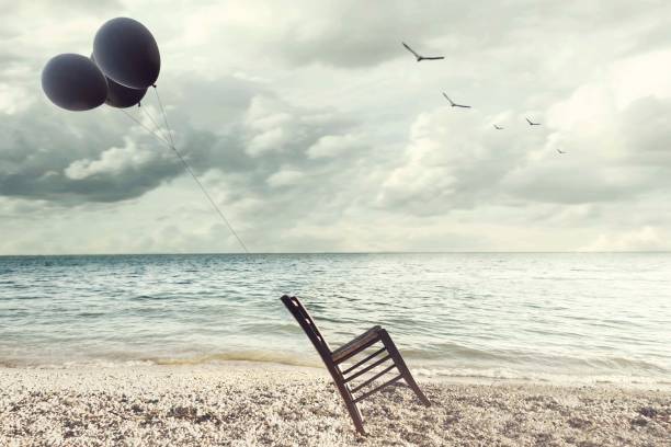 surreal image of a chair held in balance by flying balloons surreal image of a chair held in balance by flying balloons impossible possible stock pictures, royalty-free photos & images
