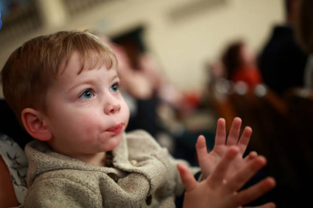 istock Kid applauding in theater 890779800