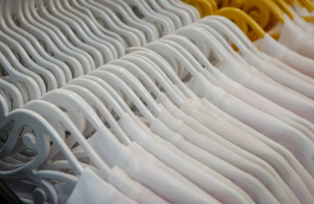 istock White shirt hanging in a hanger. 890779850
