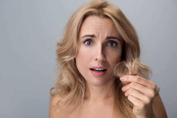 istock Worried female is feeling dissatisfaction of her curls 890787254