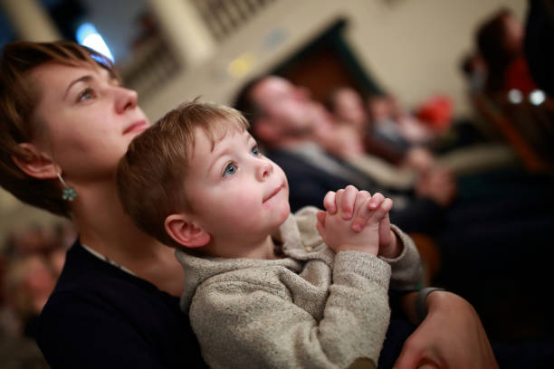 istock Mother and son in theater 890787394