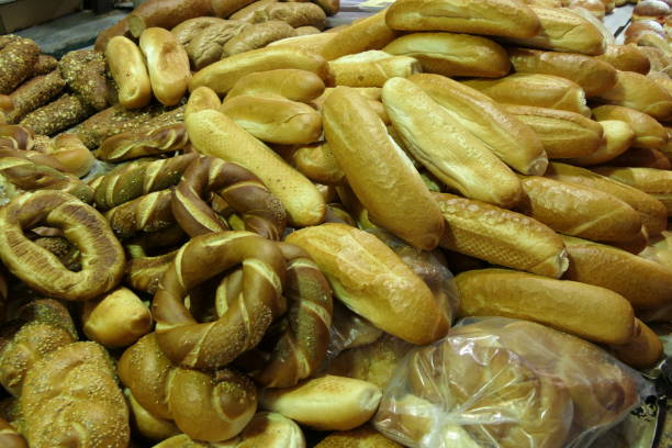 istock Market stall with a mix of fresh breads and rolls 890787426