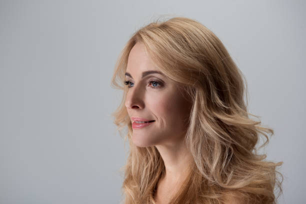 istock Charming adult woman is posing thoughtfully 890790468