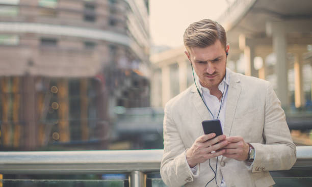istock Businessman with a headphones on 890796960