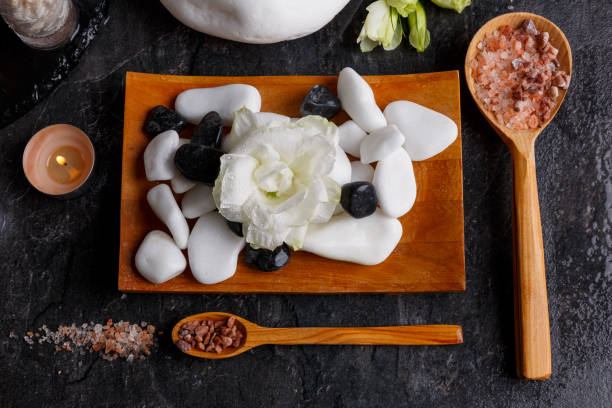 istock On a wooden board are different stones and pebbles for a spa procedure. 890797078